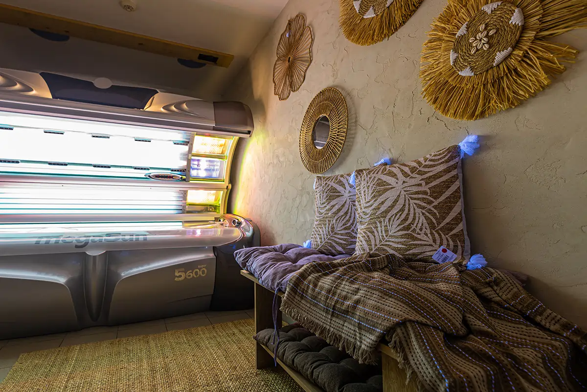 Comfortable relaxation seating area beside MegaSun tanning bed at MegaSun Solarium Larnaca